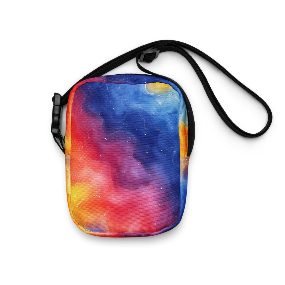 Utility crossbody bag with vibrant rainbow galaxy gradient watercolor design featuring cosmic celestial patterns