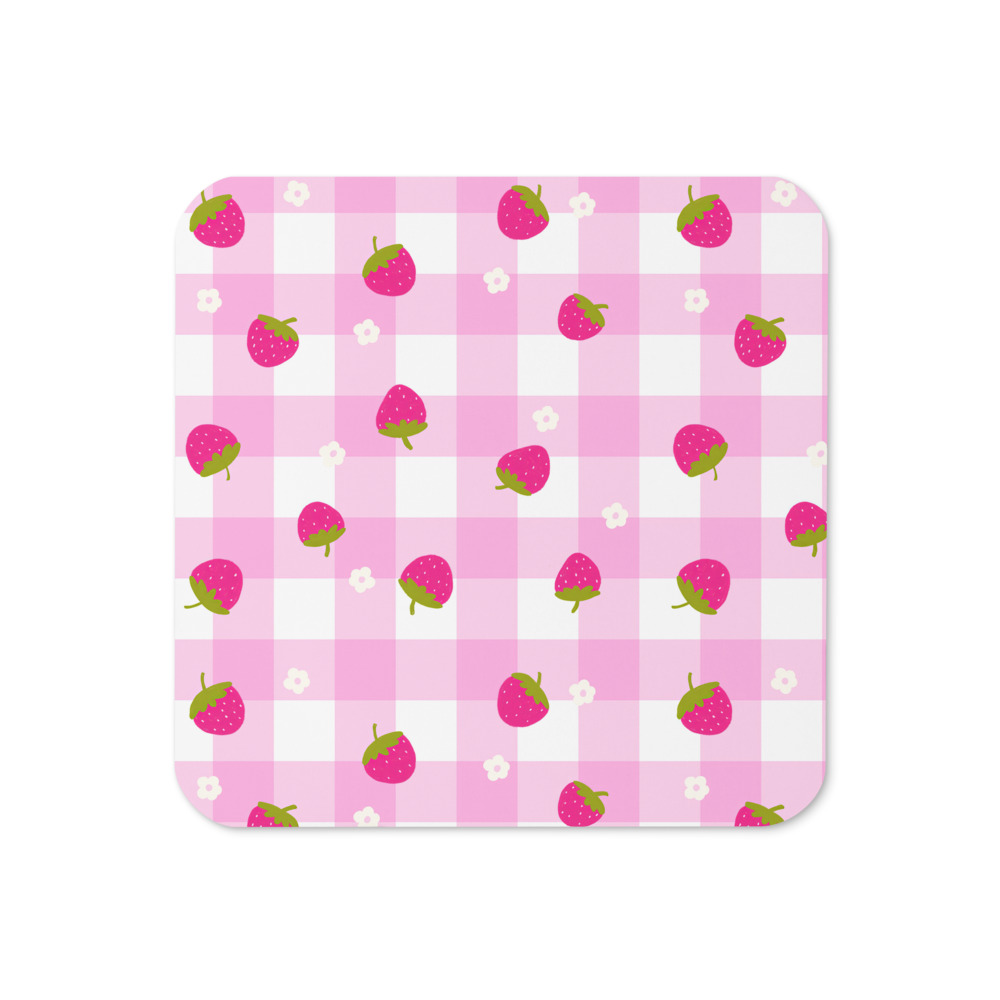 Cork-back coaster with pink gingham pattern featuring small strawberry motifs scattered across checkered background
