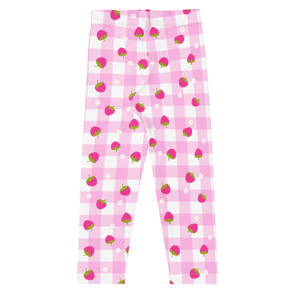Kids leggings with pink gingham background and scattered strawberry ditsy pattern in cute vintage style