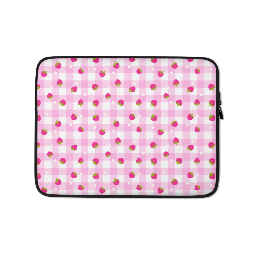 Pink gingham laptop sleeve with tiny strawberry pattern, showing neoprene construction and faux fur interior lining