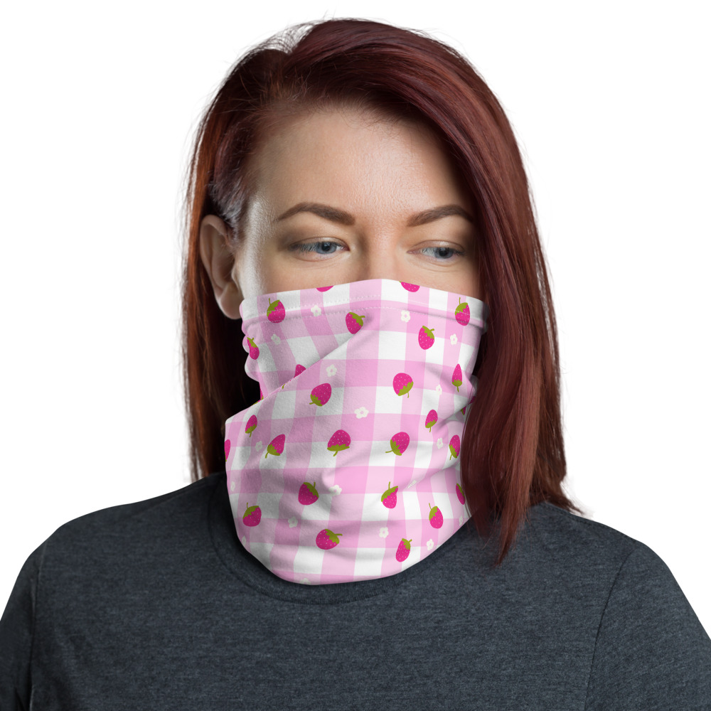 Pink gingham neck gaiter with scattered strawberry pattern showing cute ditsy fruit design