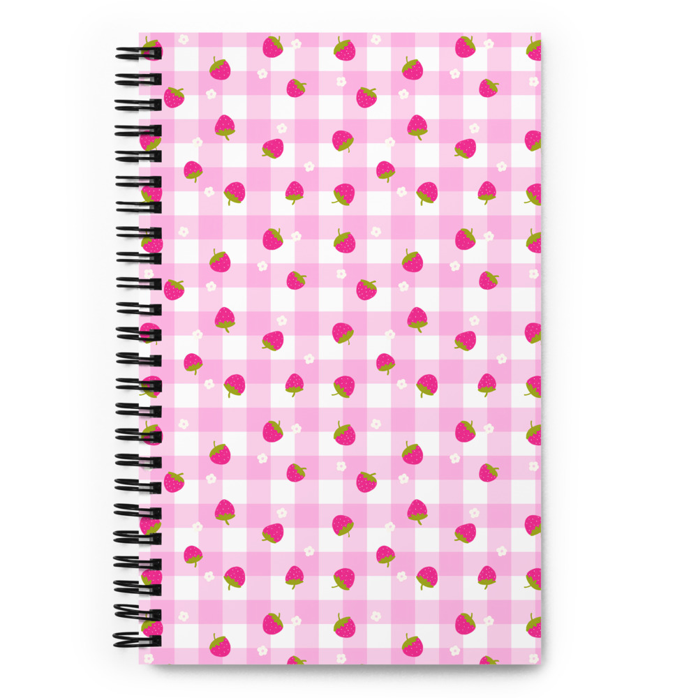 Pink gingham spiral notebook with scattered strawberry pattern, featuring soft-touch covers and dotted pages