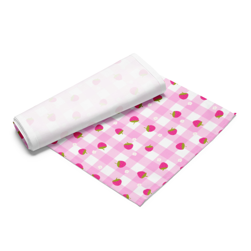 Pink gingham table runner with cute strawberry pattern, showing soft polyester fabric texture and edge-to-edge design coverage