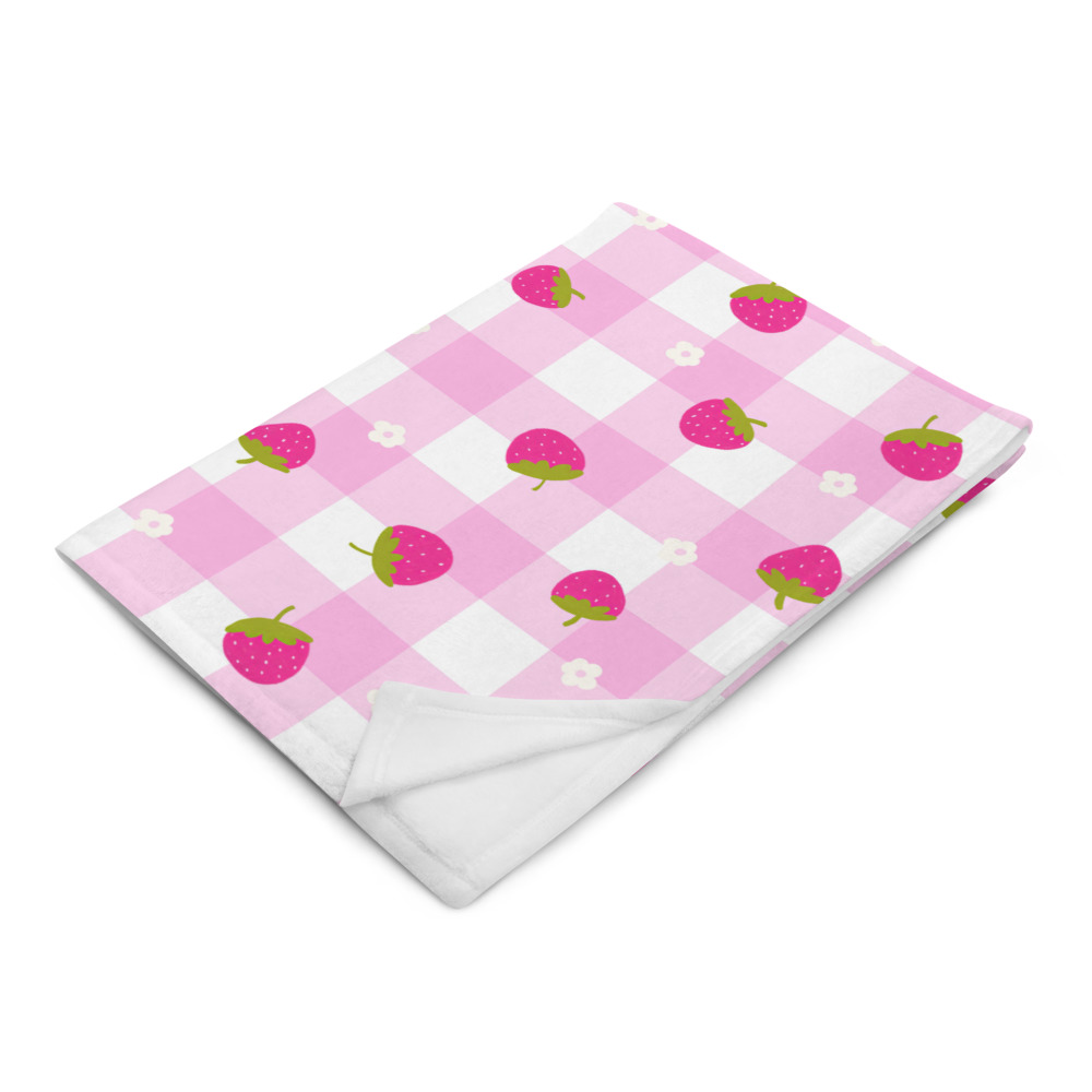 Pink gingham throw blanket with scattered strawberry ditsy pattern in cute vintage style design