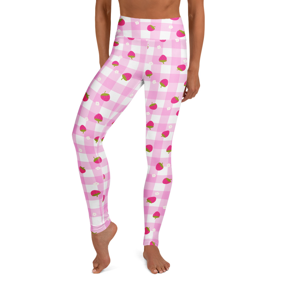 Pink gingham yoga leggings with small strawberry pattern, featuring raised waistband and body-hugging fit