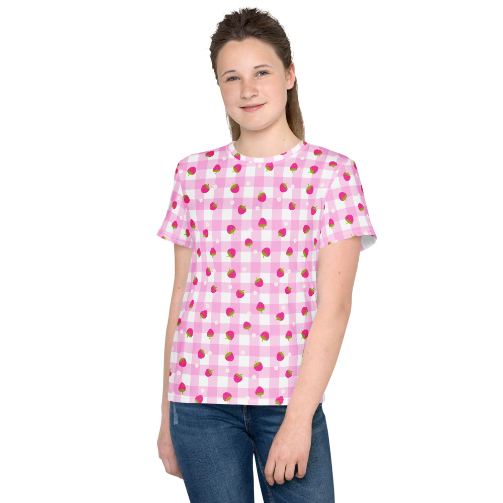 Youth crew neck t-shirt with pink gingham checkered pattern featuring small red strawberry motifs throughout design