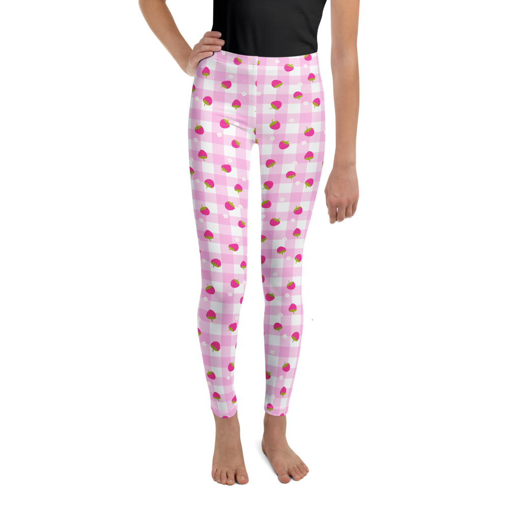 Youth leggings with pink gingham pattern featuring small strawberry design scattered across fabric